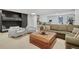 Living area featuring comfortable furniture, neutral tones, and a cozy atmosphere at 5880 S Happy Canyon Dr, Cherry Hills Village, CO 80111