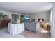 Cozy living room with a fireplace, hardwood floors, a gray sofa, and modern decor at 5880 S Happy Canyon Dr, Cherry Hills Village, CO 80111