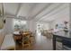 Bright living and dining area with hardwood floors and plenty of natural light at 5880 S Happy Canyon Dr, Cherry Hills Village, CO 80111