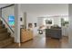 Modern living room boasts hardwood floors, large window, and a cozy fireplace at 5880 S Happy Canyon Dr, Cherry Hills Village, CO 80111