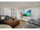Basement living room with comfortable seating and a large screen TV display at 5880 S Happy Canyon Dr, Cherry Hills Village, CO 80111