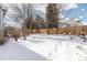 Large backyard with snow-covered ground and wooden fence at 2253 Imperial Ln, Superior, CO 80027