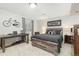 Serene bedroom with a rustic bed frame and a dedicated workspace at 2253 Imperial Ln, Superior, CO 80027