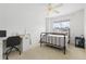 Charming bedroom with a metal bed frame and a built-in workspace at 2253 Imperial Ln, Superior, CO 80027