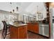 Spacious kitchen featuring an island, stainless steel appliances, and wood cabinets at 2253 Imperial Ln, Superior, CO 80027