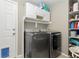 Practical laundry room with washer, dryer, and ample storage at 2253 Imperial Ln, Superior, CO 80027