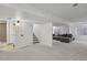 Finished basement featuring plush carpeting and a comfortable gray couch at 10291 Carrara Ter, Parker, CO 80134