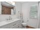 Bright bathroom with single vanity and large window at 10291 Carrara Ter, Parker, CO 80134