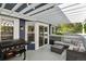 Outdoor deck featuring a grill, patio seating, and a pergola at 10291 Carrara Ter, Parker, CO 80134