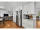 Modern kitchen with granite countertops, stainless steel appliances, and adjoining dining area at 10291 Carrara Ter, Parker, CO 80134