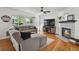 Living room boasts a fireplace, comfortable seating, and lots of natural light at 10291 Carrara Ter, Parker, CO 80134