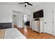 Spacious main bedroom with hardwood floors, ceiling fan, and ensuite bathroom at 10291 Carrara Ter, Parker, CO 80134