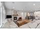 Spacious living room features a stone fireplace, recessed lighting, and hardwood floors at 15784 Burrowing Owl Ct, Morrison, CO 80465
