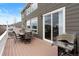 Outdoor deck with patio furniture and a grill, offering a relaxing space for dining and entertaining at 8196 Wetherill Cir, Castle Pines, CO 80108