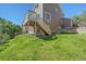 Exterior of a two-story house with a well-manicured lawn and an elevated wooden deck at 8196 Wetherill Cir, Castle Pines, CO 80108