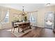 Bright dining room with hardwood floors, chandelier, a large window, and natural light at 8196 Wetherill Cir, Castle Pines, CO 80108