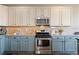 A kitchen featuring modern appliances, custom cabinetry, and a stylish backsplash, combining functionality and aesthetic appeal at 8196 Wetherill Cir, Castle Pines, CO 80108
