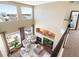 A living room featuring large windows, a fireplace, and comfortable seating, creating an inviting and bright atmosphere at 8196 Wetherill Cir, Castle Pines, CO 80108