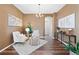Comfortable living room with hardwood floors, neutral decor, and natural lighting at 8196 Wetherill Cir, Castle Pines, CO 80108