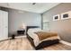 Modern bedroom featuring a dark-colored platform bed frame and matching floating nightstand at 8317 Liverpool Cir, Littleton, CO 80125