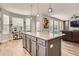 Spacious kitchen with a large island, ample storage, and an open layout, perfect for entertaining at 8317 Liverpool Cir, Littleton, CO 80125