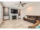 Cozy living room with a fireplace, TV, comfortable seating, and modern decor, perfect for relaxation at 8317 Liverpool Cir, Littleton, CO 80125