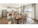 Bright dining area open to the kitchen, with a view to the exterior at 3514 Belleville Ridge Rd, Elizabeth, CO 80107