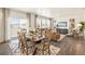 Open-concept dining and living area with hardwood floors and contemporary decor at 3514 Belleville Ridge Rd, Elizabeth, CO 80107