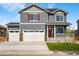 Charming two-story home with a three car garage and a welcoming front porch and red shutters at 3514 Belleville Ridge Rd, Elizabeth, CO 80107
