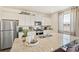 Kitchen with stainless steel refrigerator, and a large island with seating at 3514 Belleville Ridge Rd, Elizabeth, CO 80107