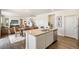 Spacious kitchen with island seating opening to the dining and living area at 3514 Belleville Ridge Rd, Elizabeth, CO 80107
