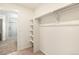 Functional walk-in closet with shelving and ample hanging space, providing organized storage solutions at 3514 Belleville Ridge Rd, Elizabeth, CO 80107
