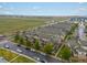 Charming aerial view of townhomes featuring well-kept landscaping, private entrances, and convenient street parking at 5800 Tower Rd # 610, Denver, CO 80249