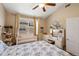 Charming bedroom with a crib, vanity, and comfortable bed featuring patterned bedding at 5800 Tower Rd # 610, Denver, CO 80249