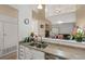 Open kitchen view overlooking the living room space with nice sink and appliances at 5800 Tower Rd # 610, Denver, CO 80249