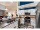 Modern kitchen featuring stainless steel appliances, white cabinets, and an open layout at 5800 Tower Rd # 610, Denver, CO 80249