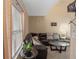 Bright and airy living room with large windows, stylish furniture, and a welcoming atmosphere at 5800 Tower Rd # 610, Denver, CO 80249