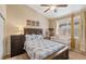 Comfortable bedroom featuring lots of light, neutral decor, and closet space at 5800 Tower Rd # 610, Denver, CO 80249