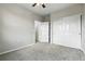 Bedroom featuring double closets and an open doorway with a view into the en suite bathroom at 8489 Canyon Rim Cir # 302, Englewood, CO 80112