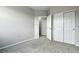 Well-lit bedroom features an en suite bathroom and double closets for added convenience and storage at 8489 Canyon Rim Cir # 302, Englewood, CO 80112