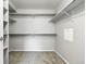 Spacious walk-in closet with shelving, offering plenty of room for organized storage at 8489 Canyon Rim Cir # 302, Englewood, CO 80112