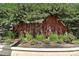 Landscaped metal sign for the Canyon Creek community at 8489 Canyon Rim Cir # 302, Englewood, CO 80112