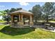 Community gazebo with stone base, wooden structure, and seating area for outdoor enjoyment at 8489 Canyon Rim Cir # 302, Englewood, CO 80112