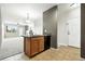 Kitchen view featuring wood cabinets and stainless appliances, living room view at 8489 Canyon Rim Cir # 302, Englewood, CO 80112