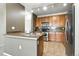 Kitchen featuring tile flooring, cabinets, granite countertops and stainless appliances at 8489 Canyon Rim Cir # 302, Englewood, CO 80112