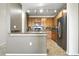 Kitchen featuring tile floor, stainless steel appliances, and granite countertops at 8489 Canyon Rim Cir # 302, Englewood, CO 80112
