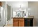Kitchen with cabinets and stainless appliances and view of living room area at 8489 Canyon Rim Cir # 302, Englewood, CO 80112