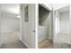 Laundry area with washer and dryer adjacent to carpeted hallway and partial view of dining area at 8489 Canyon Rim Cir # 302, Englewood, CO 80112