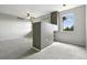 Lofted living room with neutral carpeting, a modern fan, and lots of natural light at 8489 Canyon Rim Cir # 302, Englewood, CO 80112