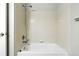 Tile-surround shower-tub with showerhead and standard fixtures at 8489 Canyon Rim Cir # 302, Englewood, CO 80112